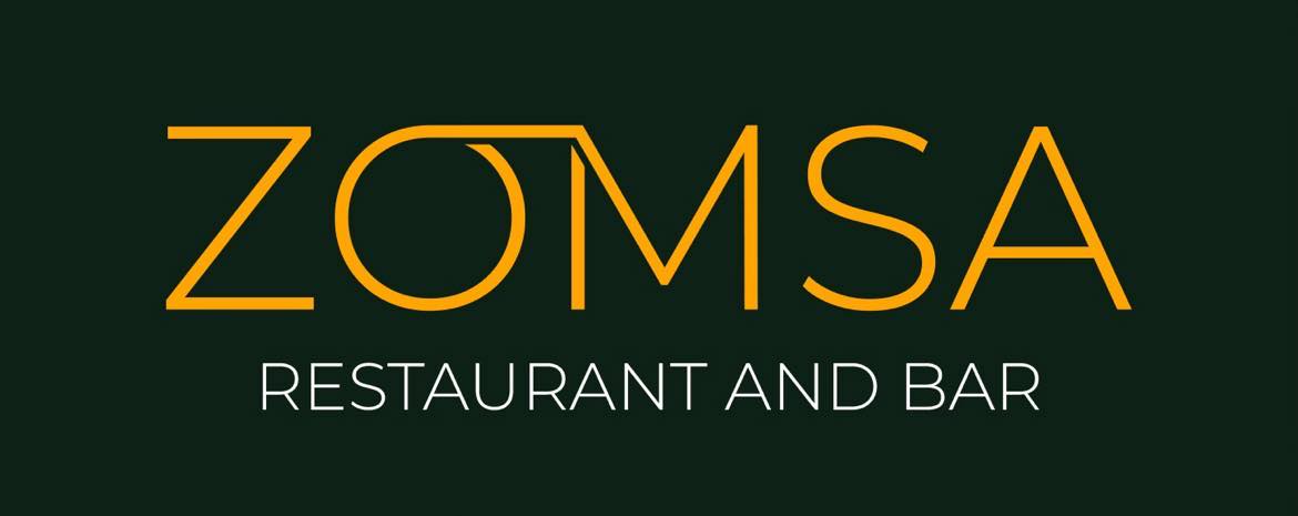 Logo Of Zomsa Restaurant And Bar Featuring Bold, Gold Letters On A Dark Green Background.